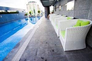 ATC Furniture’s poly rattan wicker sofa at Pullman Saigon Center’s poolside