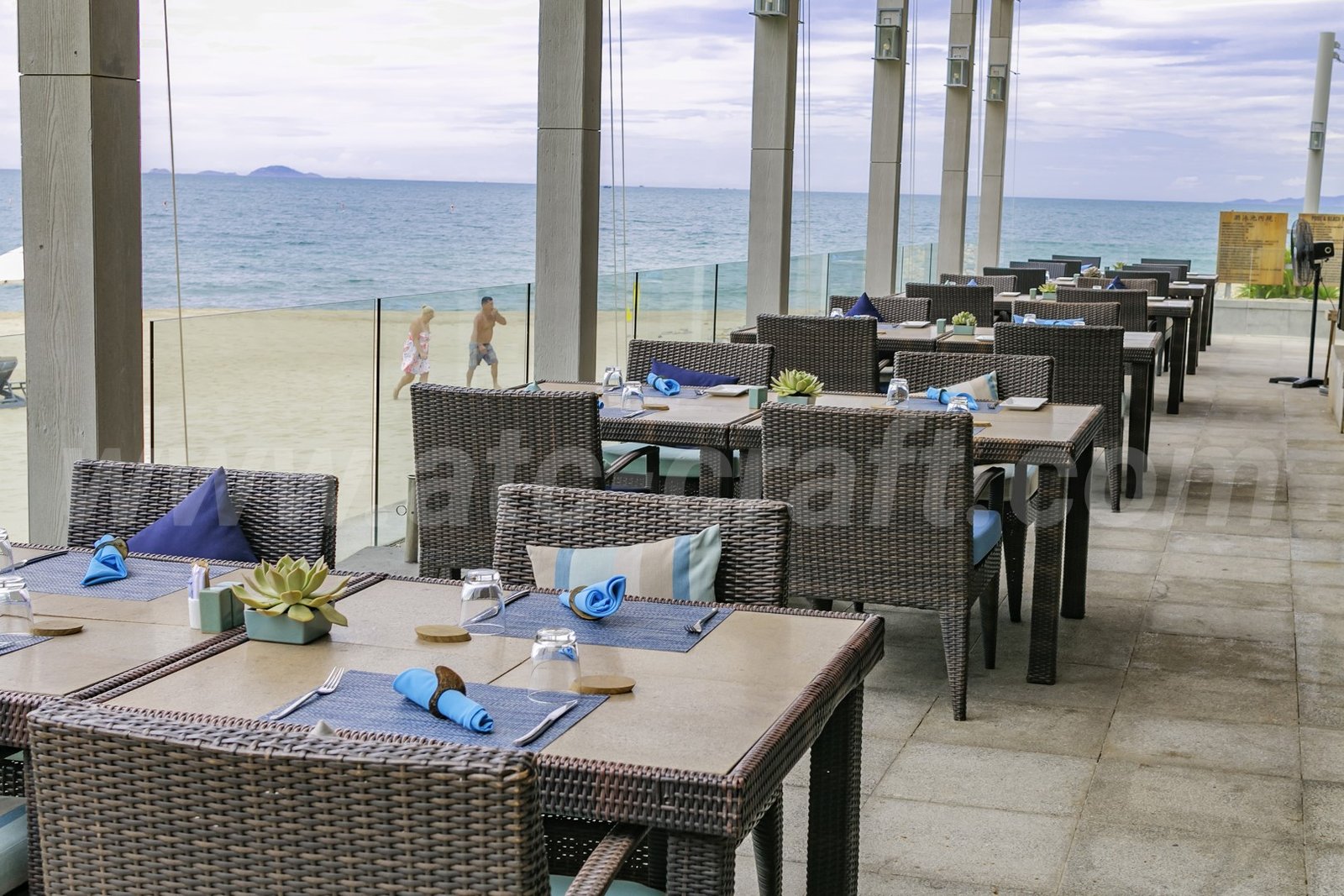 blue marine resort with coastal patio dining set