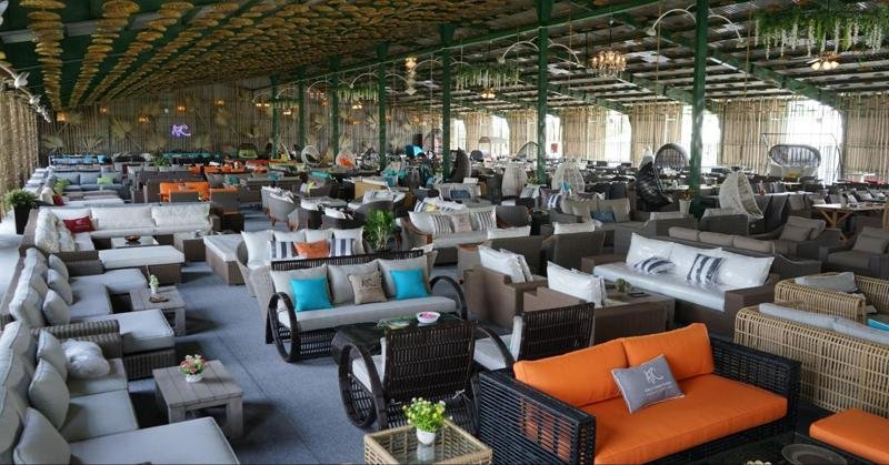 Wholesale furniture display in a large warehouse, showcasing various seating options